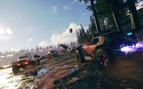 HD Onrush game wallpaper featuring high-speed racing action with cars on a muddy forest track.