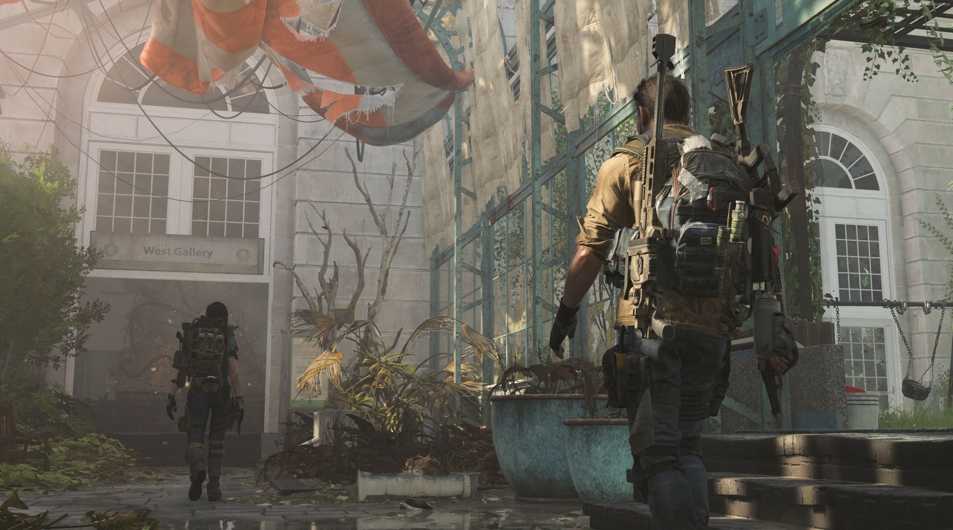 HD PC desktop wallpaper from Tom Clancy's The Division 2 featuring armed soldiers with rifles navigating an urban environment.