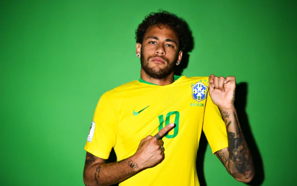 Brazilian soccer star Neymar in a vibrant yellow jersey with number 10, set against a bright green background. 4K Ultra HD PC desktop wallpaper and sports image.