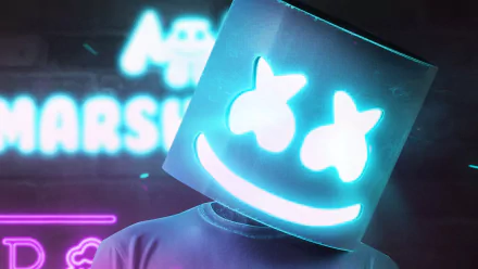 HD desktop wallpaper featuring Marshmello, DJ and musician, with his signature helmet and a neon background displaying his name.