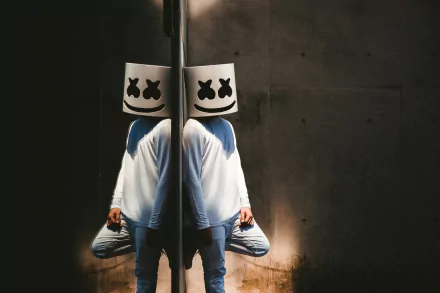 HD desktop wallpaper featuring Marshmello (DJ) with his signature helmet, reflected in a mirror against a dark background.