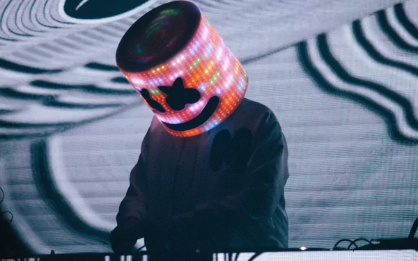 HD desktop wallpaper featuring DJ Marshmello, with his iconic illuminated helmet, performing music against a dynamic background.