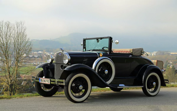 A black vintage Ford Model A convertible classic car parked outdoors with a scenic background, captured in 4K Ultra HD quality.