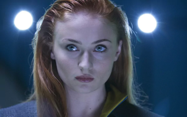 Sophie Turner as Jean Grey in a 4K Ultra HD wallpaper from the X-Men: Dark Phoenix movie, showcasing a close-up of her intense expression.
