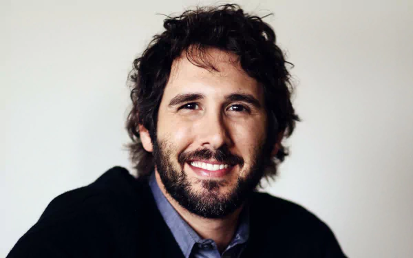 HD wallpaper featuring a smiling person with a beard, tagged as Josh Groban, with a neutral background, for desktop use.