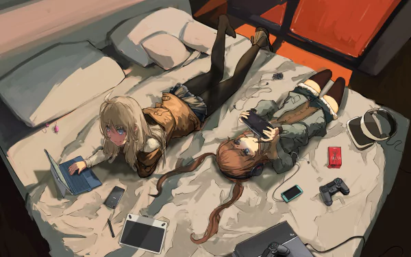 Anime-style HD desktop wallpaper featuring two girls with blue eyes and brown to blonde hair, lying on a bed with a laptop, tablet, and gaming accessories scattered around.