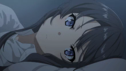 An HD desktop wallpaper featuring Mai Sakurajima from the anime Rascal Does Not Dream of Bunny Girl Senpai, lying down with her eyes open, creating a serene and contemplative atmosphere.