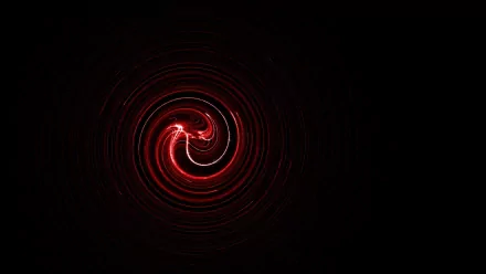 An abstract HD desktop wallpaper featuring a mesmerizing red spiral design on a dark background, creating a dynamic and vibrant visual effect.