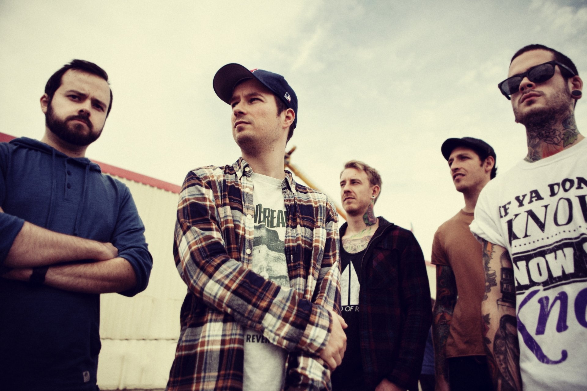 HD wallpaper featuring the band Funeral for a Friend, with members posed confidently against a sky backdrop.