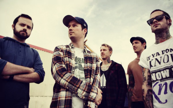 HD wallpaper featuring the band Funeral for a Friend, with members posed confidently against a sky backdrop.