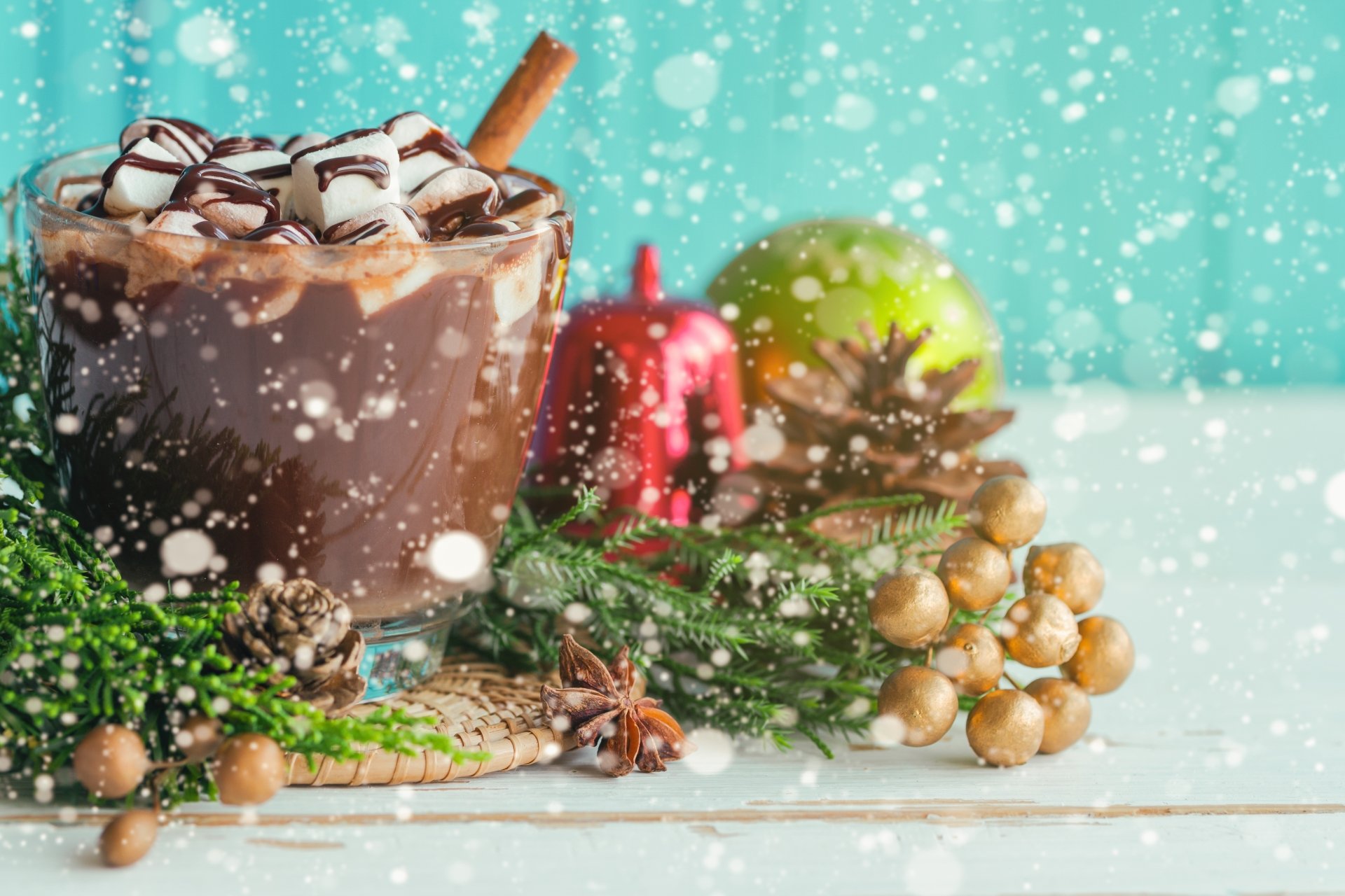 Close-up hot chocolate with marshmallows, chocolate drizzle and cinnamon stick amid pinecones and berries, festive food scene — 4K Ultra HD PC desktop wallpaper background.