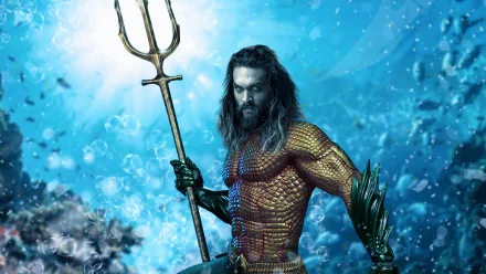 HD PC desktop wallpaper featuring Jason Momoa as Aquaman, holding a trident against a vibrant underwater background.