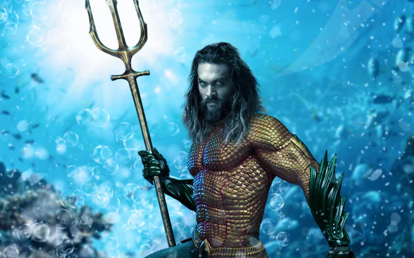 HD PC desktop wallpaper featuring Jason Momoa as Aquaman, holding a trident against a vibrant underwater background.