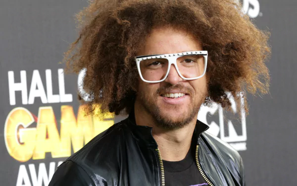 HD desktop wallpaper featuring a person with an Afro, white glasses, and a black jacket, associated with LMFAO.