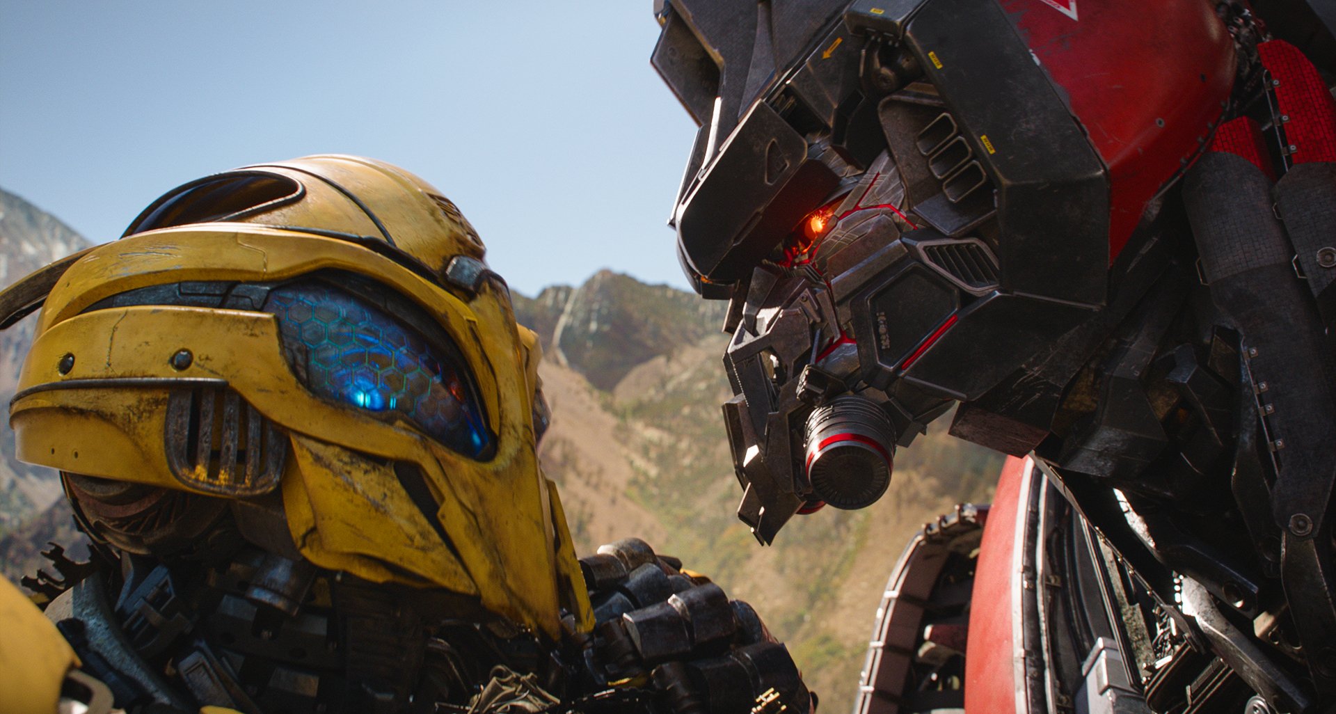 4K Ultra HD desktop wallpaper featuring a close-up of Bumblebee and another Transformer from the Transformers movie against a mountainous backdrop.