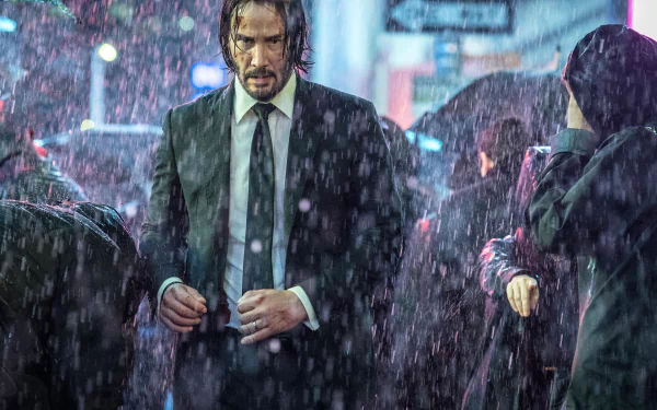 HD desktop wallpaper featuring Keanu Reeves as John Wick in a rain-soaked scene from the movie John Wick: Chapter 3 – Parabellum.