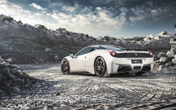 White Ferrari 458 Italia supercar parked on rocky terrain under a dramatic sky — 2K Quad HD PC desktop wallpaper/background.