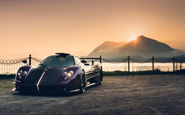 Purple Pagani Zonda supercar parked by a lakeside fence with a silhouetted mountain at sunset — 4K Ultra HD PC desktop wallpaper background.