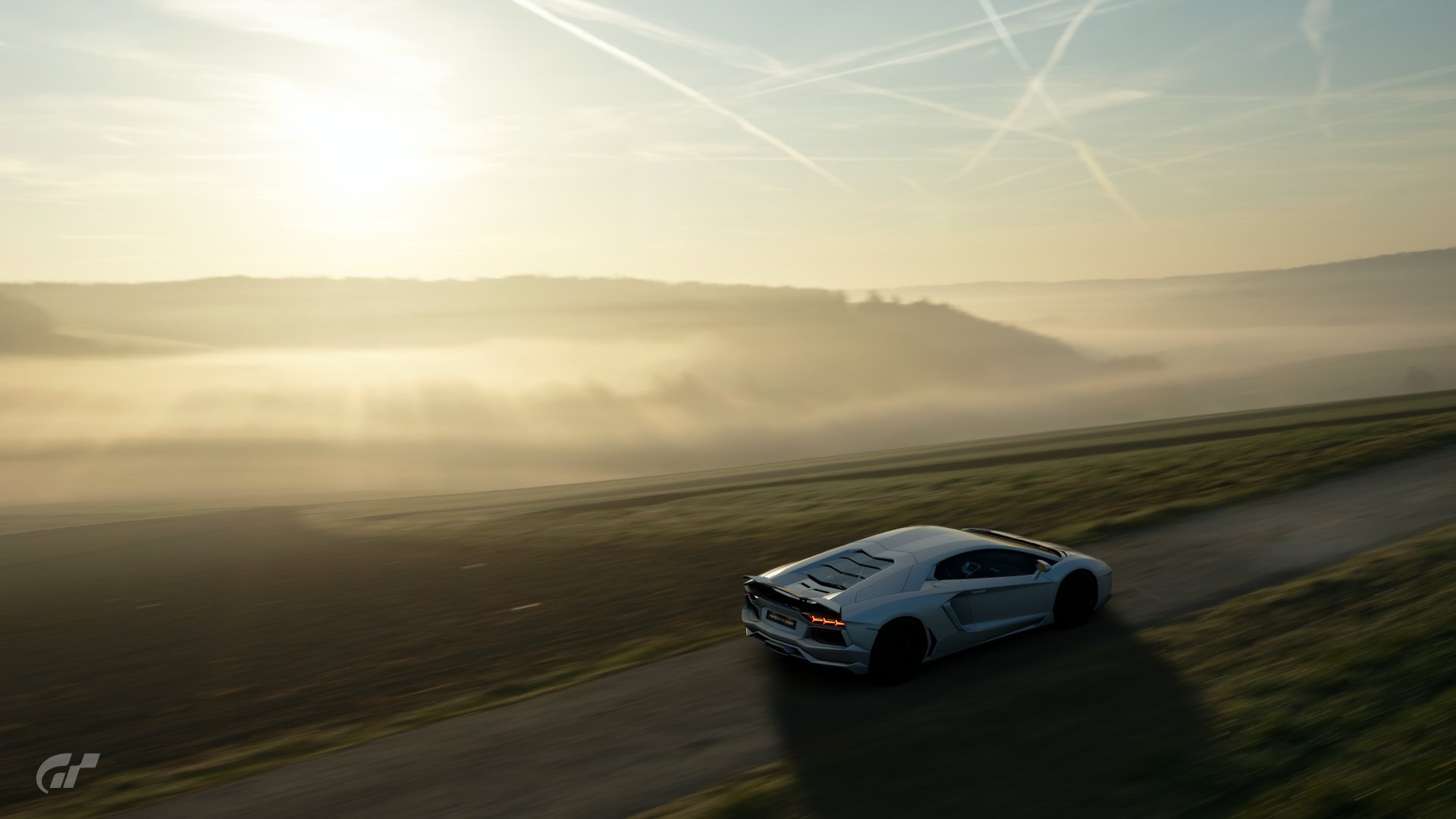 White Lamborghini Aventador on a misty country road in the Gran Turismo Sport video game — 4K Ultra HD PC desktop wallpaper/background.