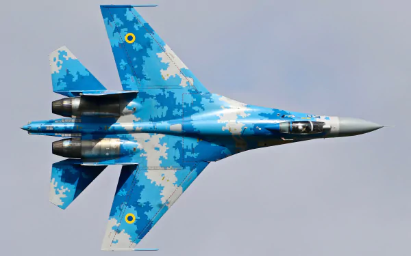 4K Ultra HD PC desktop wallpaper of a Ukrainian Air Force Sukhoi Su-27 jet fighter in blue digital camouflage, a military warplane aircraft.
