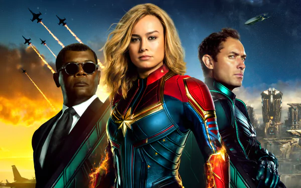 HD desktop wallpaper featuring Captain Marvel movie characters Nick Fury, Captain Marvel, and another individual. Tagline: Samuel L. Jackson, Brie Larson, Captain Marvel, movie action.
