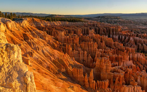 Sunrise over Bryce Canyon National Park in Utah, showcasing vivid red rock formations and expansive canyon landscape in stunning 4K Ultra HD detail.