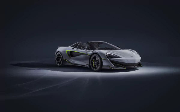 Silver McLaren 600LT supercar showcased on a dark background, featured as a 4K Ultra HD PC desktop wallpaper.
