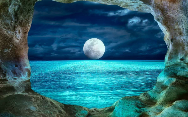 HD desktop wallpaper showing a full moon over a calm ocean as seen from inside a rocky cave at night, capturing the serene beauty of nature.