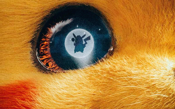 Close-up of Pikachu's eye reflecting the silhouette of Detective Pikachu from the Pokémon movie, rendered in 4K Ultra HD for PC desktop wallpaper and background.