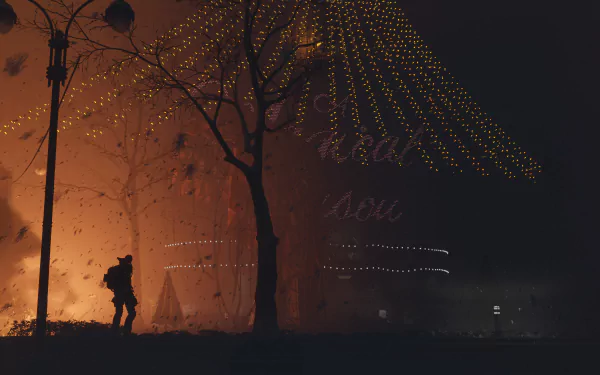 4K Ultra HD PC wallpaper featuring a dark, atmospheric scene from Tom Clancy's The Division 2 with a lone figure silhouetted against glowing orange light and string lights above.